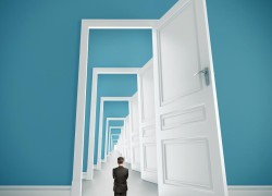 Opening Doors businessman in blue room with doors open
